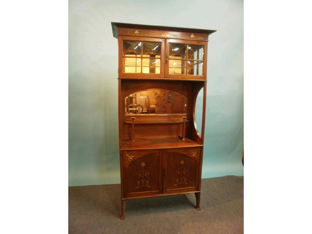 Appraisal: A mahogany display cabinet in the manner of Liberty inlaid