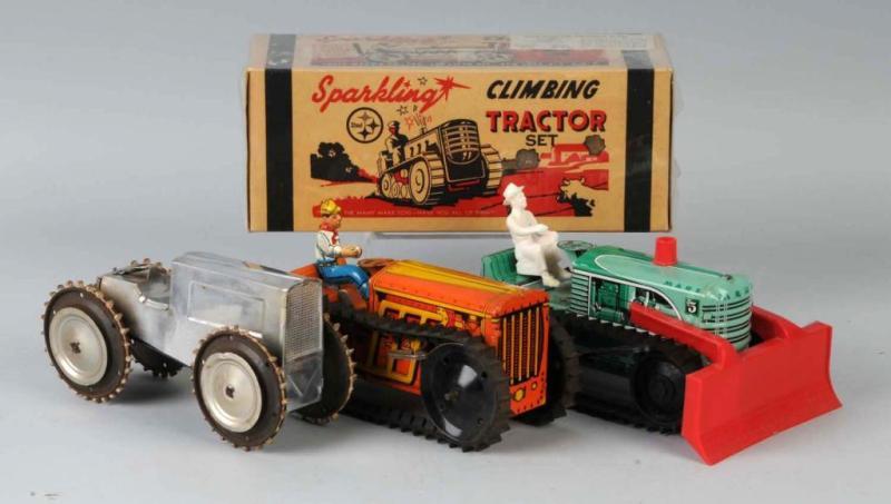 Appraisal: Lot of Tin Tractor Wind-Up Toys Description American Working Includes