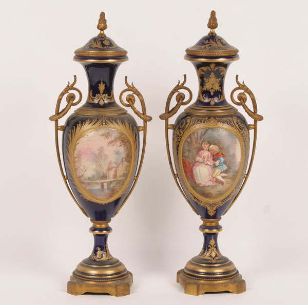 Appraisal: Pair classic French Sevres style cobalt porcelain lidded vases urns