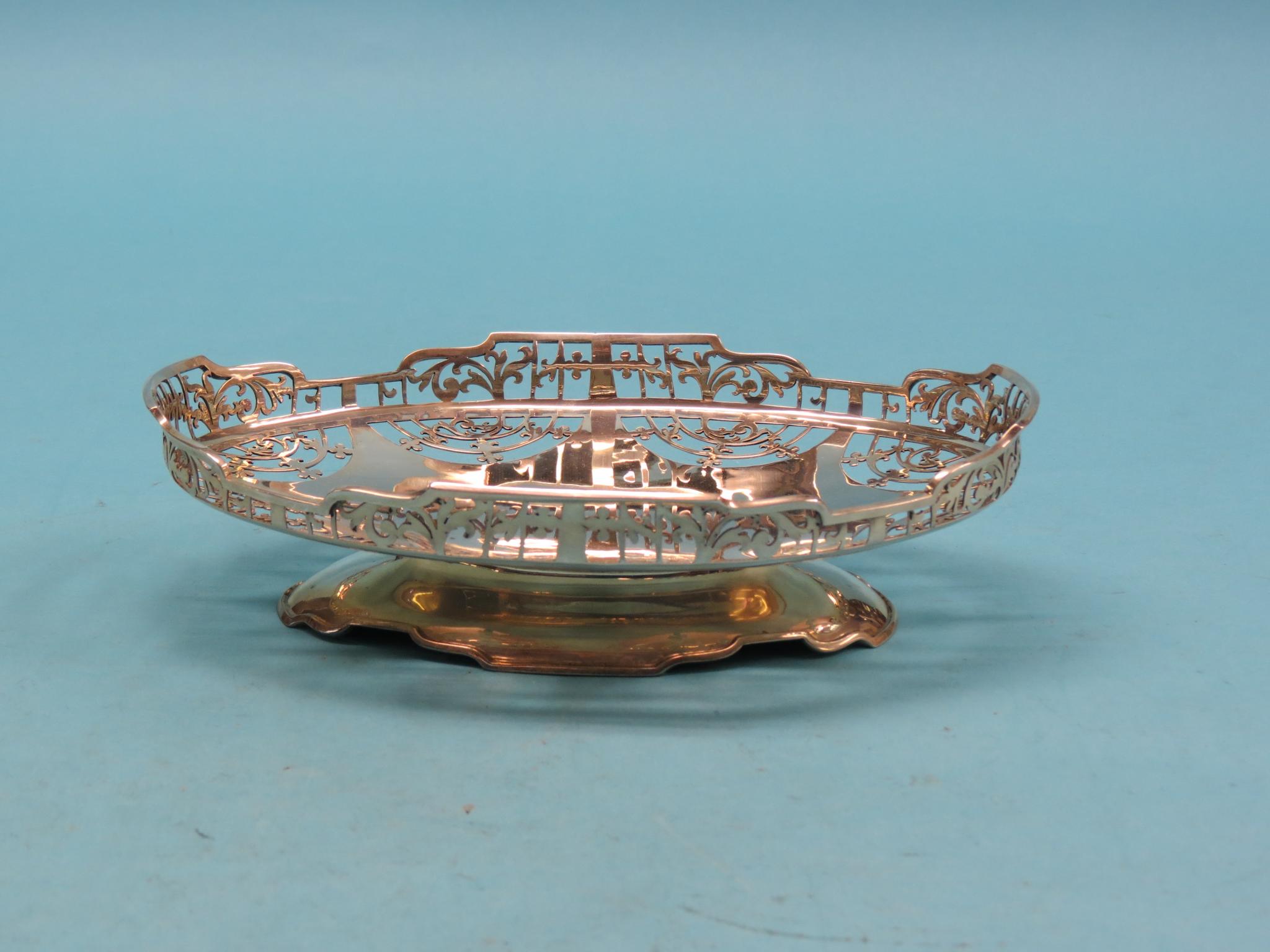 Appraisal: An oval silver basket pedestal form with pierced detail London