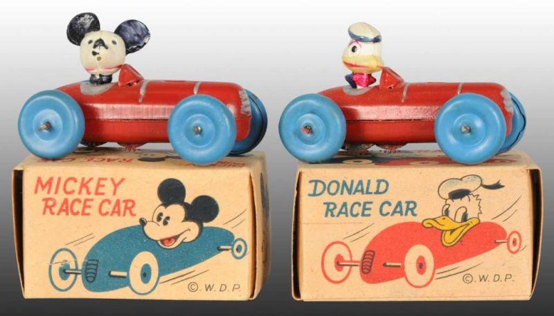 Appraisal: Lot of Occupied Japanese Disney Race Car Toys Description Mickey