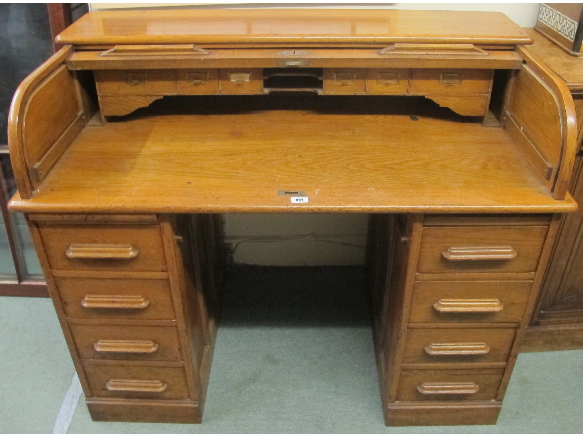 Appraisal: An Edwardian oak roll top desk