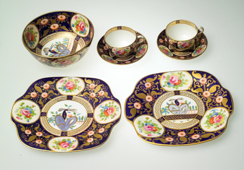 Appraisal: CROWN STAFFORDSHIRE PARTIAL TEA SERVICE EARLY th CENTURY in a