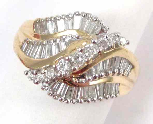 Appraisal: DIAMOND AND FOURTEEN KARAT GOLD RING set with four curved