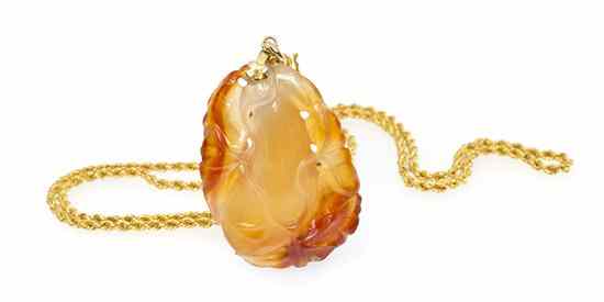 Appraisal: A Karat Yellow Gold and Carved Carnelian Pendant Necklace in