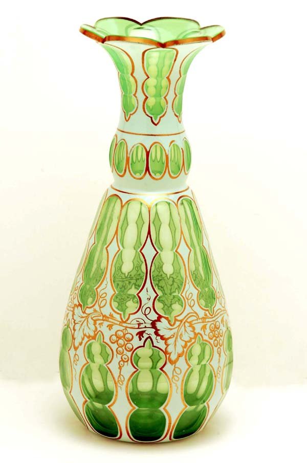 Appraisal: A large Bohemian white over green cut overlay vase decorated