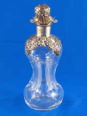 Appraisal: A silver mounted whisky decanter the body waisted to four