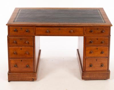 Appraisal: A Victorian pedestal desk fitted nine drawers around a kneehole