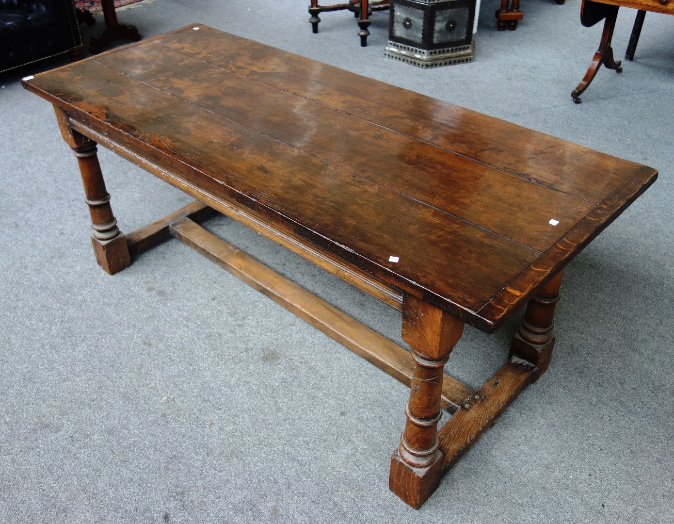 Appraisal: A th century style oak refectory table the cleated plank