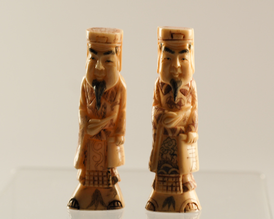 Appraisal: A Pair of Figural Netsukes men with hats beards and