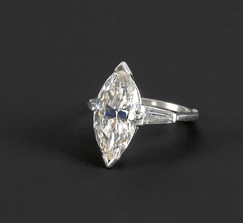 Appraisal: Diamond ring in a platinum arthritic setting containing a marquise