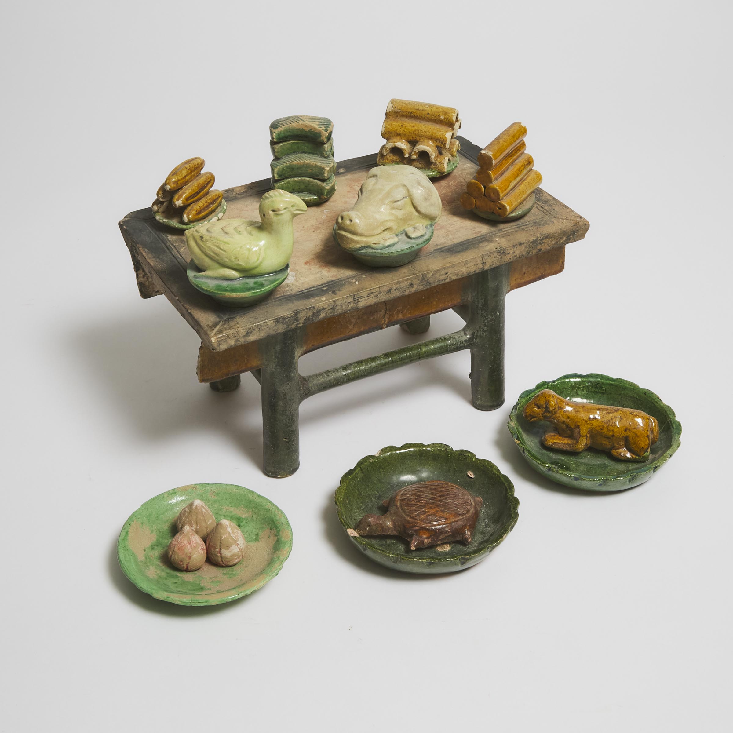 Appraisal: A Set of Ten Sancai-Glazed Pottery Food Offerings and Table