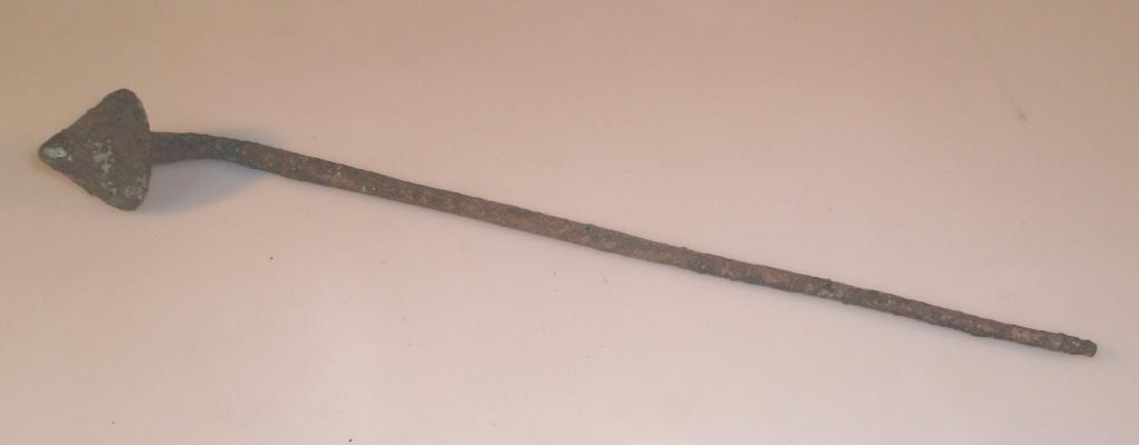 Appraisal: An ancient long cast bronze implement with a conical finial