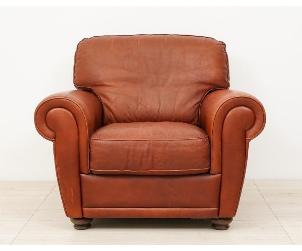 Appraisal: Stitched leather club chair with fixed cushion and mellow used