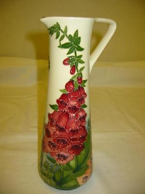 Appraisal: A MOORCROFT POTTERY EWER of tapering cylindrical form tube lined