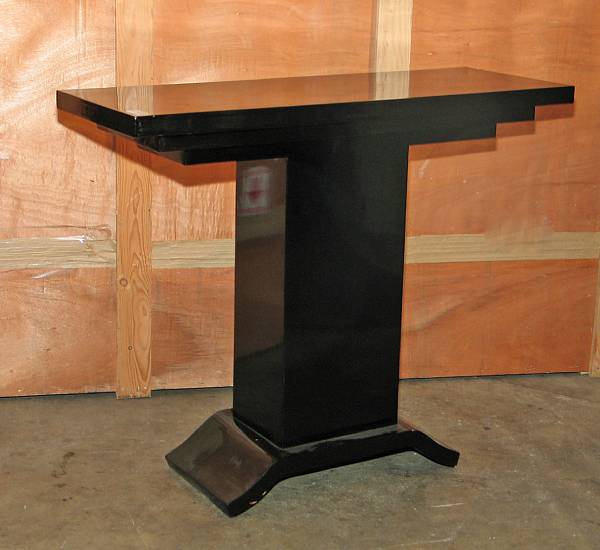 Appraisal: A pair of Art Deco style black lacquered console tables