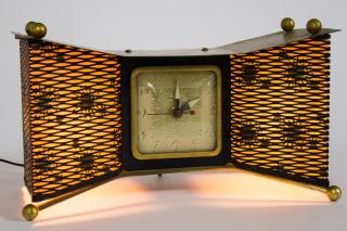 Appraisal: Mid Rare vintage streamlined brass Snowflake lighting electric clock by