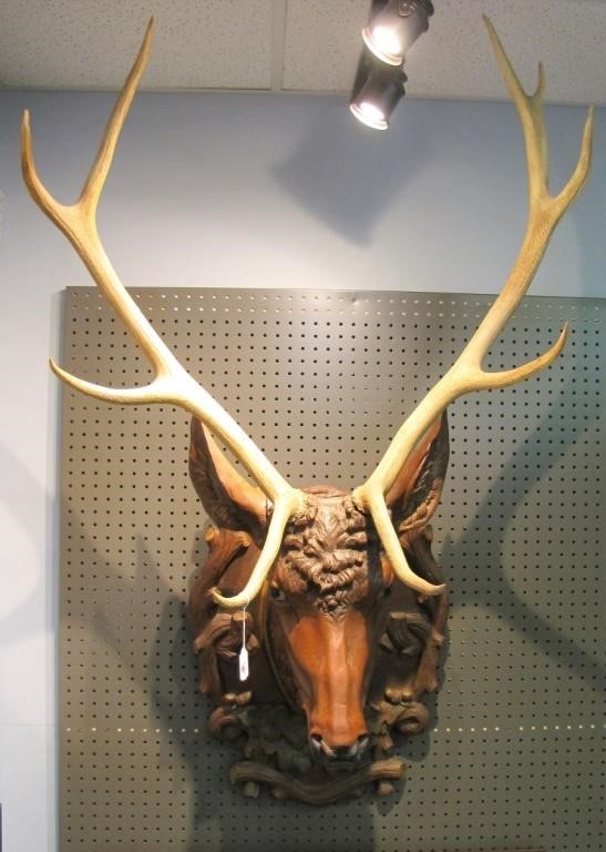 Appraisal: A th century black forest carved stag head hand painted