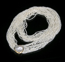 Appraisal: A Mabe Pearl Slider With Seventeen Strands Of Seed Pearls