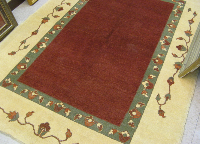 Appraisal: HAND KNOTTED ORIENTAL CARPET Pakistani Zeigler centering a plain rectangular