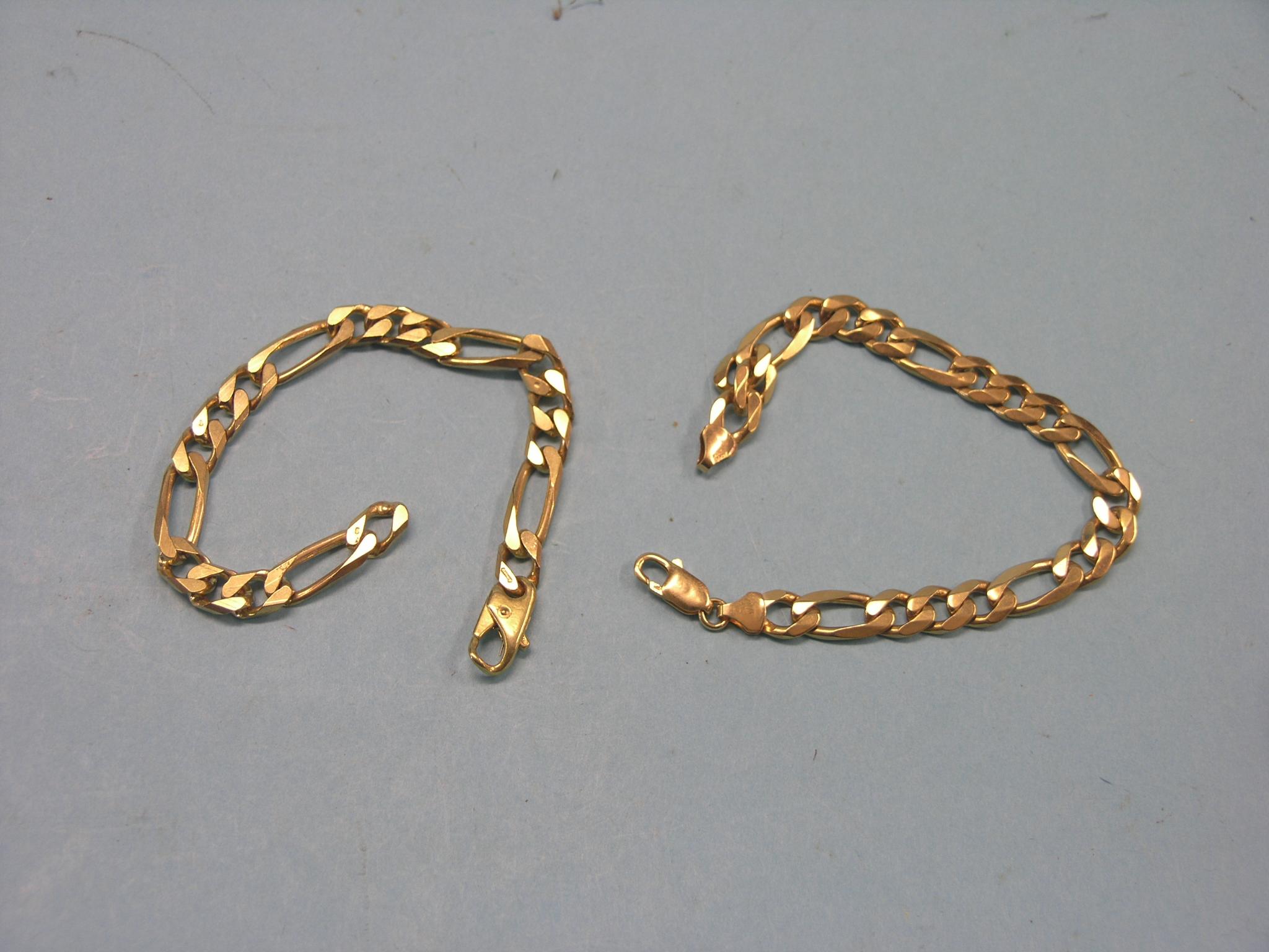 Appraisal: Two near-matching ct gold solid-link curb bracelets grams total