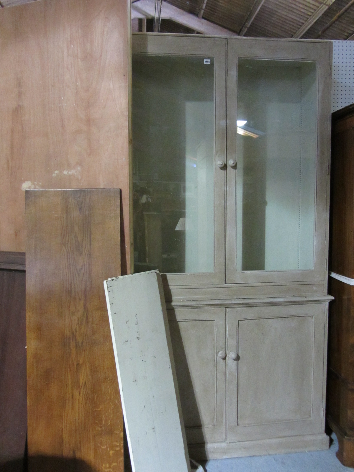 Appraisal: A green painted bookcase cabinet