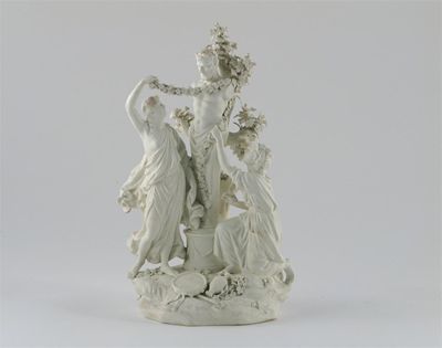 Appraisal: A Derby biscuit model of two bacchantes adorning a bust