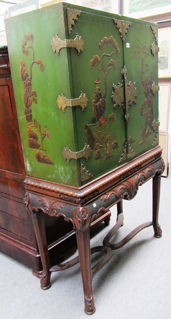 Appraisal: A cabinet on stand with green and gilt chinoiserie style