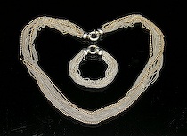 Appraisal: Ladies' Multichain Sterling Silver and Gold Necklace with Matching Bracelet