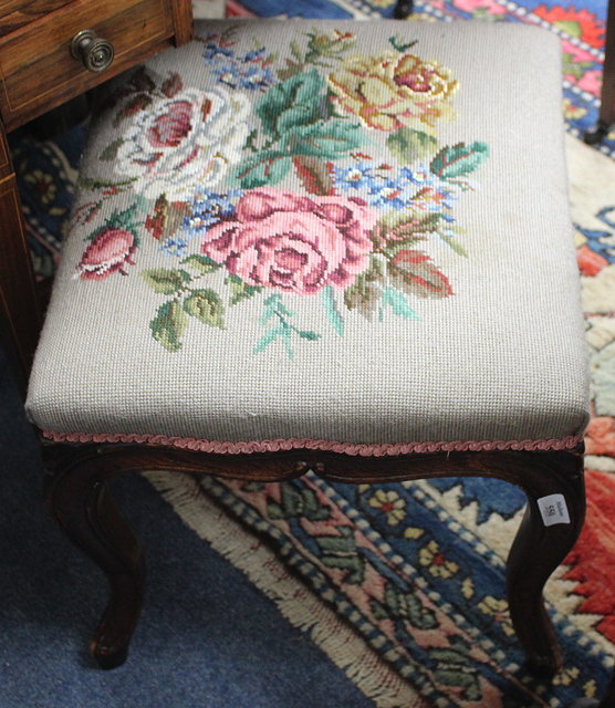 Appraisal: A VICTORIAN SIMULATED ROSEWOOD STOOL with overstuffed upholstered needlework seat