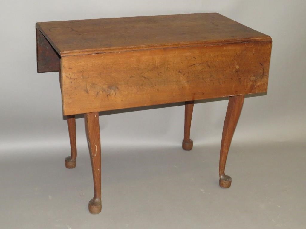 Appraisal: DROPLEAF TABLEca in walnut with rosehead nailed construction two drawers