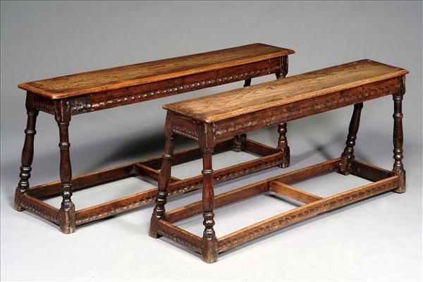 Appraisal: A matched pair of oak long stools th century and