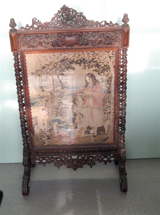 Appraisal: th century mahogany fire screen profusely carved throughout with spiral