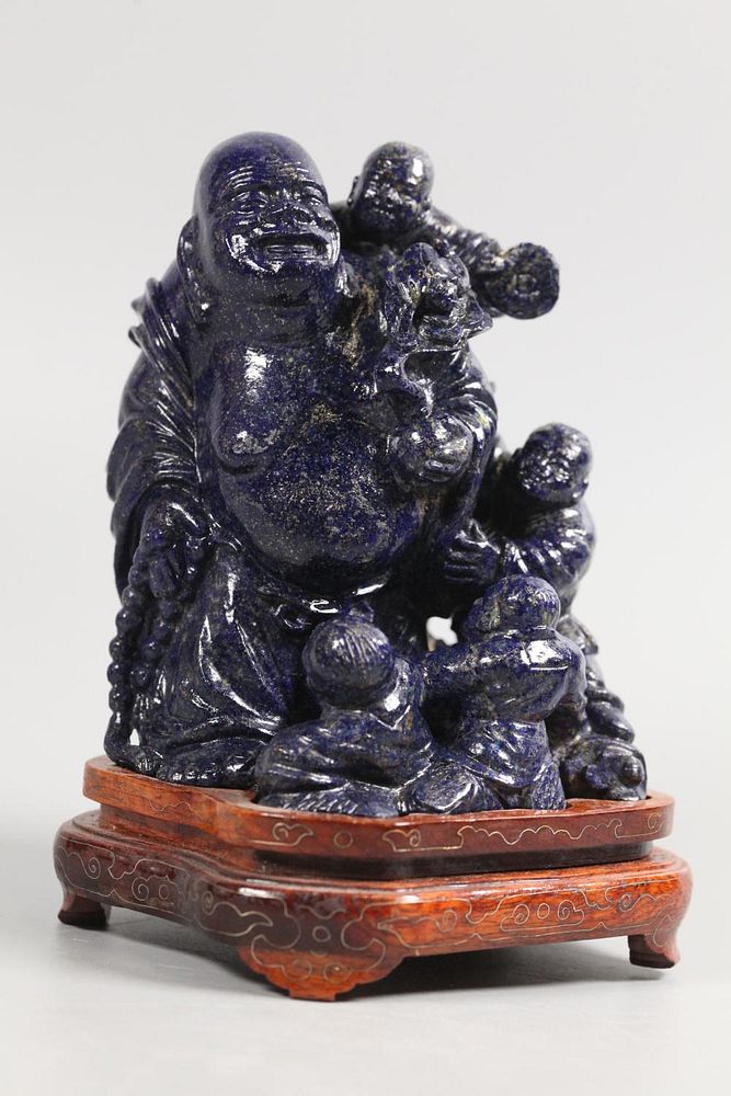 Appraisal: Chinese lapis carving of immortal surrounded by children overall with