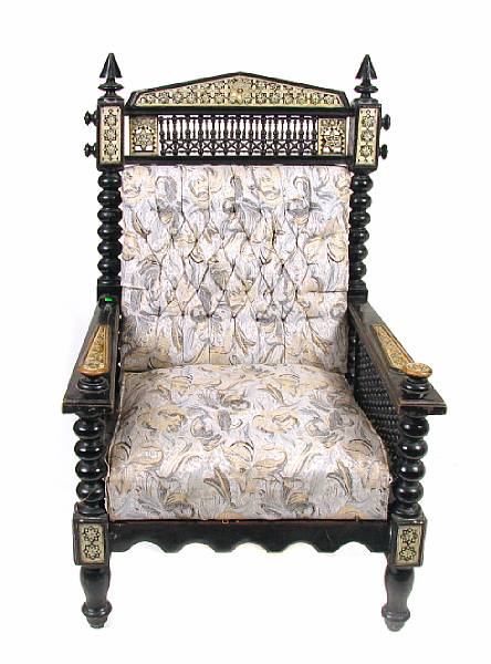 Appraisal: A pair of Moorish style ebonized and inlaid upholstered armchairs