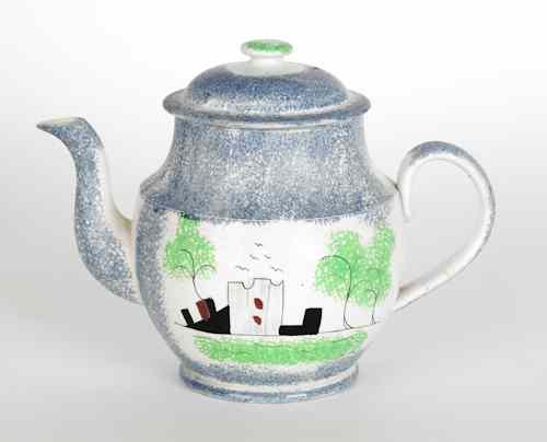 Appraisal: Blue spatter teapot with a fort and a tree th