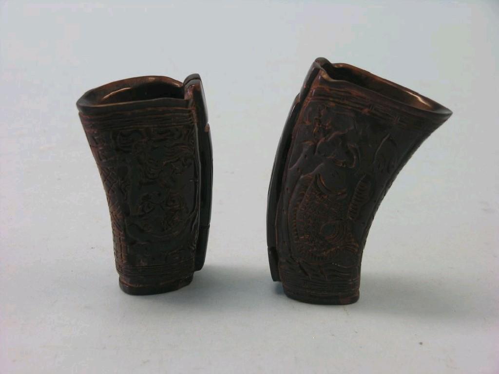 Appraisal: A pair of Chinese horn libation cups upright curved shape