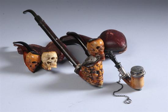 Appraisal: FIVE MEERSCHAUM PIPES Three with skeleton head bowls one plain