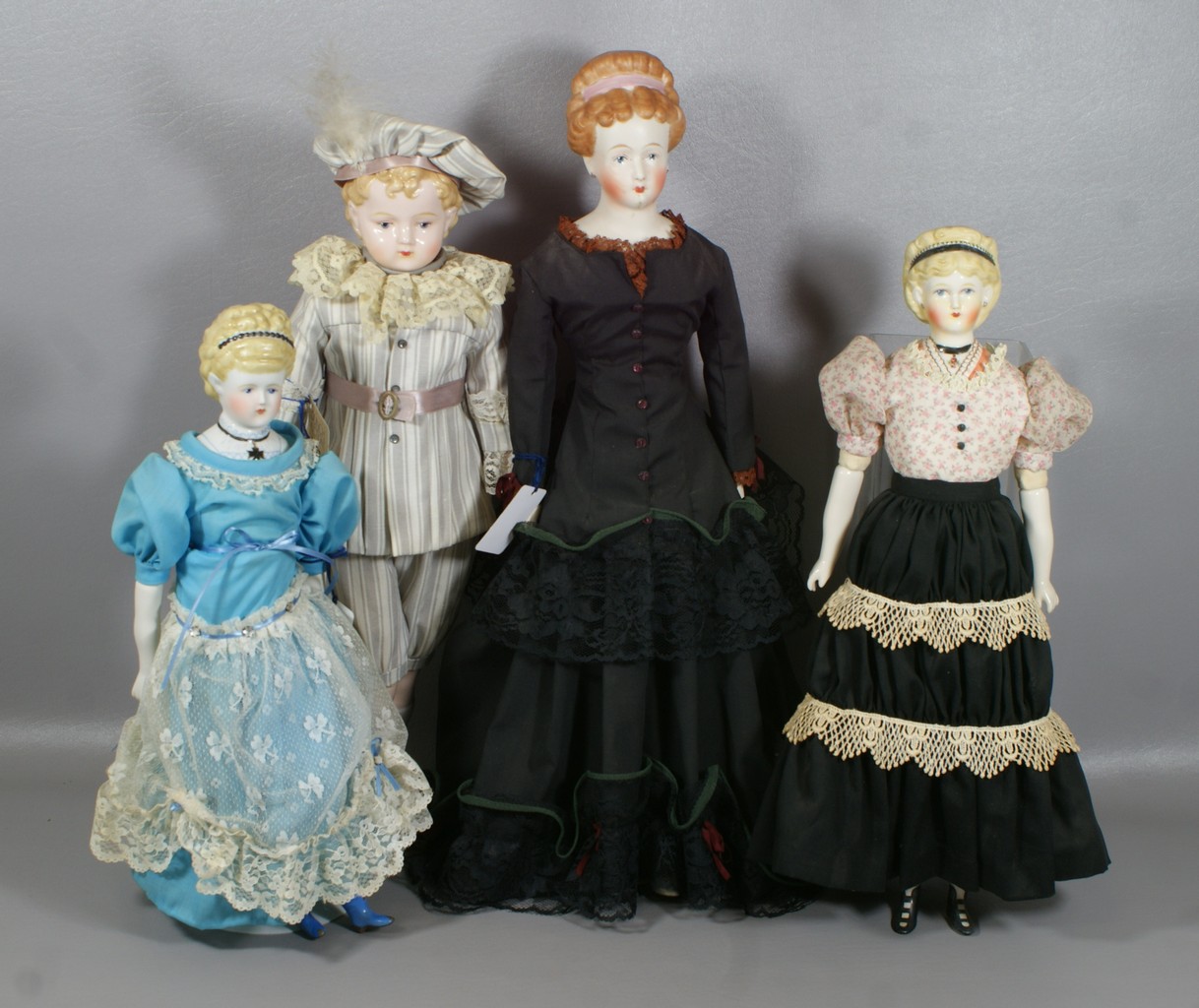 Appraisal: Reproduction Late th Century Dolls including Parians with upswept hairdos