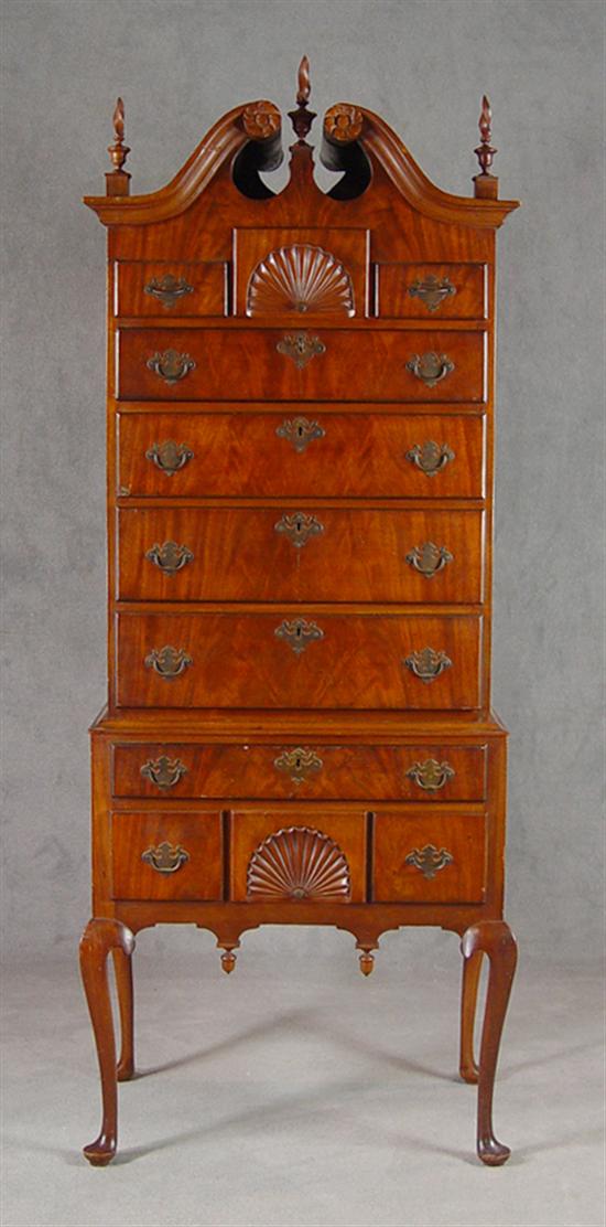 Appraisal: Diminutive English Highboy th Century Bonnet top with carved rosettes