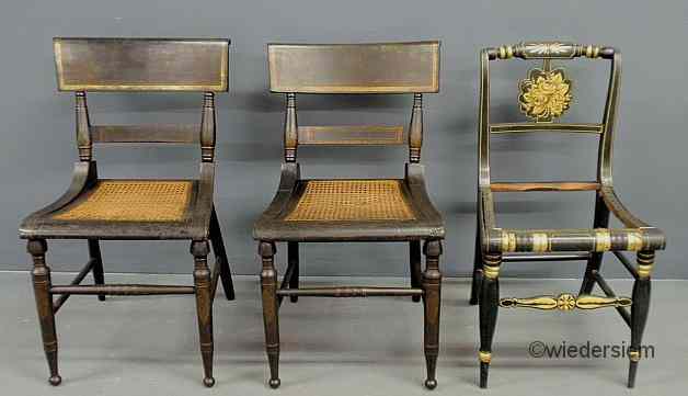 Appraisal: Pair of black painted fancy chairs with stenciled American Indian