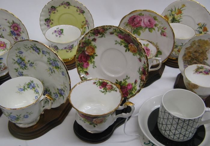 Appraisal: COLLECTION OF ASSORTED TEACUPS AND SAUCERS and display racks Including