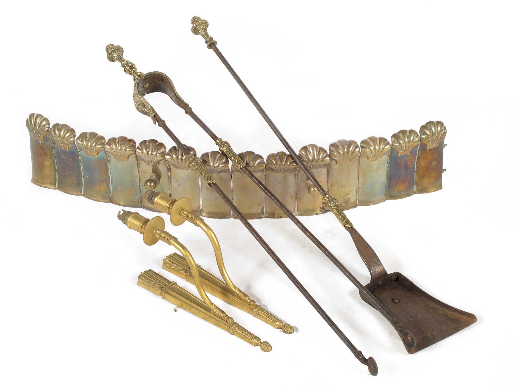 Appraisal: Two th century gilt brass and steel fire tools