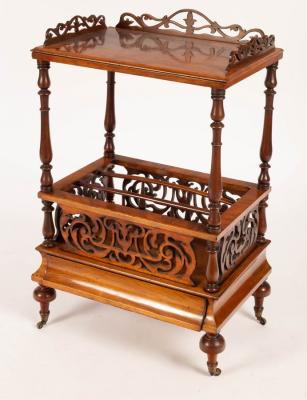 Appraisal: A Victorian walnut three-division Canterbury with galleried top and fret