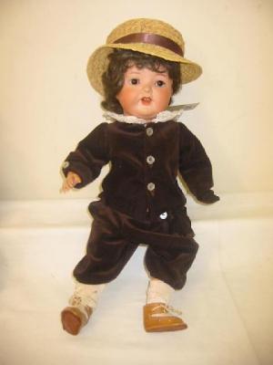 Appraisal: An Armand Marseille bisque head character doll with brown glass