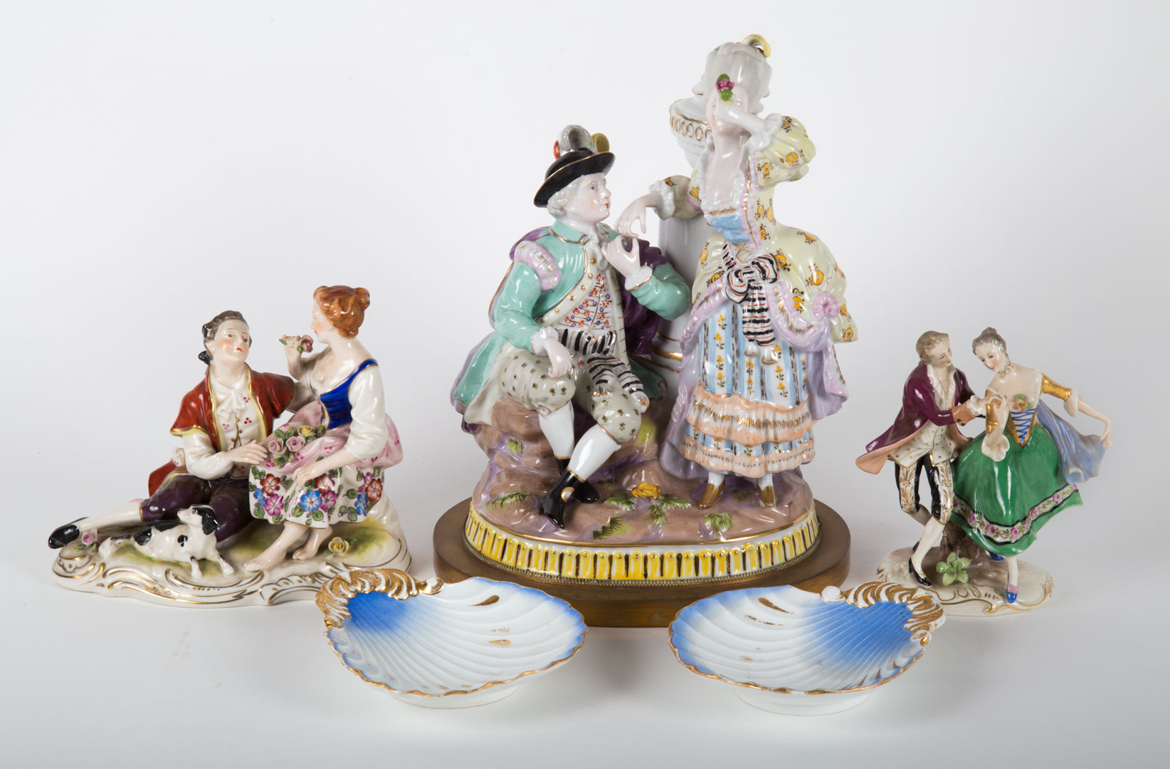 Appraisal: German porcelain figural groups and dishes th century includes three