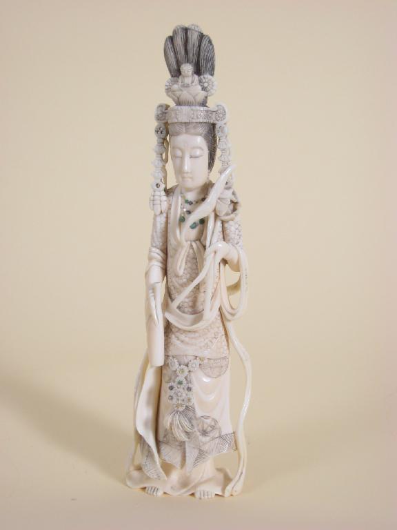 Appraisal: A carved ivory Figure of a lady standing with jewelled