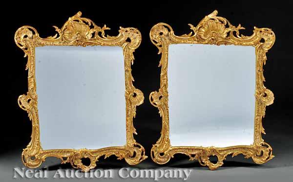 Appraisal: A Pair of Italian Rococo Carved and Gilded Mirrors probably