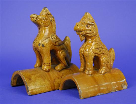 Appraisal: TWO CHINESE YELLOW GLAZED POTTERY LION FORM ROOF TILES Ming