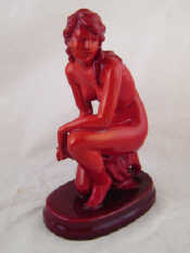 Appraisal: A Zsolnay figure of a nude in red glaze ht